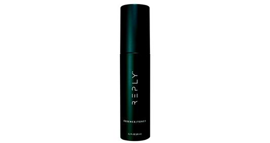 Black cylindrical bottle of REPLY - Essence/Toner.