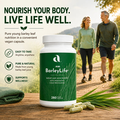 A bottle of AIM BarleyLife dietary supplement capsules displayed on a wooden surface with loose capsules and barley leaves, set against a lifestyle background of a couple walking on a country path with promotional text on the left.