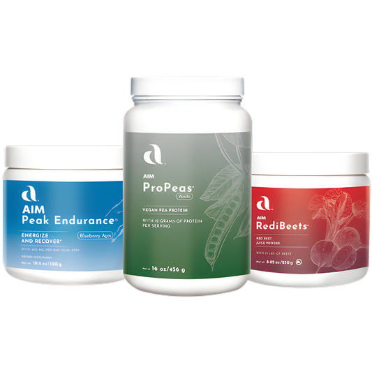 Three white supplement jars from AIM arranged together on a white background: Peak Endurance in blue on the left, ProPeas in green in the center, and RedBeets in red on the right.